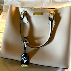 NWOT - TRINA TURK Tan SHOULDER/CROSSBODY BAG. Beige with black/white interior.